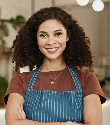 portrait-arms-crossed-and-happy-woman-in-coffee